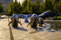 Uzbekistan, Tashkent - September 27, 2023: A fountain with shiny steel dolphins in Tashkent City Park.