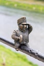 Uzhgorod, Ukraine - April 27, 2016: Small bronze statue of Good Soldier Svejk attached to the handrails