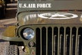 close-up of a military vehicle grille and headlights. old us air force jeep with star on the hood Royalty Free Stock Photo