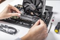 Installing random access memory into PC.