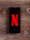 Netflix company logo on the smartphone screen.