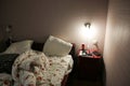 UZHHOROD, UKRAINE - APRIL 14, 2019: Hotel room. Bedside table with things. Tourist concept. Travelling