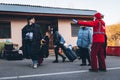 Uzhhorod, Ukraine - 16 March 2022: Humanitarian assistance of volunteers. A Red Cross volunteer shows Ukrainian refugees the way t