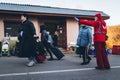 Uzhhorod, Ukraine - 16 March 2022: Humanitarian assistance of volunteers. A Red Cross volunteer shows Ukrainian refugees the way t