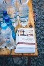 Uzhhorod, Ukraine - 16 March 2022: Humanitarian assistance of volunteers. Water and brochures with religious support for refugees.