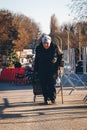 Uzhhorod, Ukraine - 16 March 2022: An old woman goes to the border with the European Union to escape the war in Ukraine.