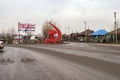 Soviet sculpture `Hammer and Sickle` on Lenin Street, in the autumn, on a cloudy day.