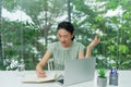 V bUnhappy young woman looking at laptop screen, irritated by bad gadget work, low internet connection, working remotely at home Royalty Free Stock Photo