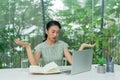 V bUnhappy young woman looking at laptop screen, irritated by bad gadget work, low internet connection, working remotely at home Royalty Free Stock Photo