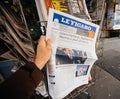 V buying Le Figaro newspaper front page with the picture of the newly elected French president Emmanuel Macron
