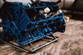 V8 Engine block table, painted in blue color.