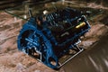 V8 Engine block table, painted in blue color.