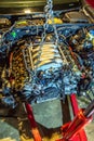 V8 engine out on hoist to get rebuilt Royalty Free Stock Photo