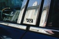V12 engine sign on jaguar fast vintage glass