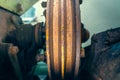 V-pulley with corrosion in the recesses close-up. Old worn double pulley tractor. Rust on iron parts of agricultural machinery