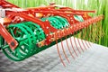 V-ring roller and rows of tines for agricultural