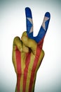 V sign patterned with the Catalan pro-independence flag Royalty Free Stock Photo