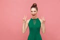 V sign, peace. Woman toothy smiling and showing four fingers Royalty Free Stock Photo