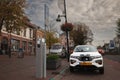 VAALS, NETHERLANDS - NOVEMBER 9, 2022: Selective blur on an electric car, an SUV, charging at a charging station used to fill with