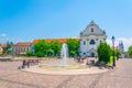 VAC, HUNGARY MAY 21, 2016: View of the Marcius 15 square in the hungarian city Vac dominated by the feherek church Royalty Free Stock Photo