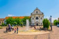 VAC, HUNGARY MAY 21, 2016: View of the Marcius 15 square in the hungarian city Vac dominated by the feherek church Royalty Free Stock Photo