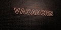 VACANCIES -Realistic Neon Sign on Brick Wall background - 3D rendered royalty free stock image