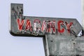 Vacancy sign on a deserted motel - worn, broken and forgotten VACANCY sign Royalty Free Stock Photo