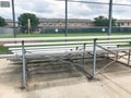 Vacant bleachers near empty baseball field with metal chain link in Dallas, Texas, USA Royalty Free Stock Photo