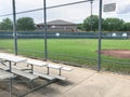 Vacant bleachers near empty baseball field with metal chain link in Dallas, Texas, USA Royalty Free Stock Photo