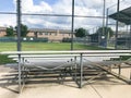 Vacant bleachers near empty baseball field with metal chain link in Dallas, Texas, USA Royalty Free Stock Photo