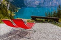 Vacant deckchairs mountain lake at summer relaxing view