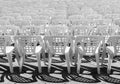 Vacant empty plastic white chairs pattern.