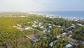 Vacant land next to lush green state park, dense of white painted vacation homes, condo buildings, residential units in Seagrove Royalty Free Stock Photo