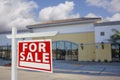 Vacant Retail Building with For Sale Real Estate Sign Royalty Free Stock Photo