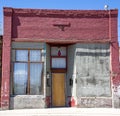 Empty vacated small brick storefront building Royalty Free Stock Photo