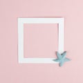 Vacation background with a frame, text box on a pastel rose colored background, holiday trip, greeting card with seas stars Royalty Free Stock Photo