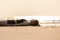 Vacation of Beautiful Attractive Asian woman relaxing in yoga Savasana pose on the beach with beautiful sea in Tropical island