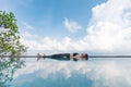 Vacation of Beautiful Attractive Asian woman relaxing in yoga Savasana pose on the pool above the beach with beautiful sea in Trop Royalty Free Stock Photo