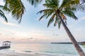 Vacation of Beautiful dining table on white beach with villas over water in Maldives Royalty Free Stock Photo