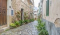 Vacation, Beautiful street in Valldemossa with traditional flower decoration, famous old mediterranean village of Majorca. Royalty Free Stock Photo