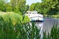 Vacation boat in Canal du Midi, family travel cruise by barge penichette, holidays in France Royalty Free Stock Photo