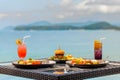 Vacation breakfast or dinner table at restaurant with sea view in tropics Royalty Free Stock Photo