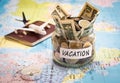 Vacation budget concept with compass, passport and aircraft toy