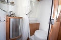 Vacation campervan interior bathroom wc wooden in modern new motor home toilet Royalty Free Stock Photo