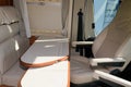 Vacation campervan interior table wooden and seat in modern new motor home on vanlife concept Royalty Free Stock Photo