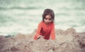 Vacation with children. Kid enjoying time at the sand beach. Child making sandcastle on sea. Royalty Free Stock Photo