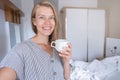 Happy woman showing her hotel room taking selfie