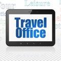 Vacation concept: Tablet Computer with Travel Office on display Royalty Free Stock Photo