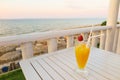 Vacation drink orange juice with strawberry view of sea