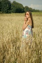Vacation, eco tourism, agritourism. Beauty, fashion, lifestyle. Young woman in wheat field, agriculture